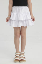 Falda de niña con vuelos blancos diseño liso sin estampa con dos capas de vuelos estilo casual y cómodo