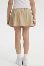 Falda beige de niña con pliegues laterales y lazos en la cintura diseño liso ideal para un look casual fresco