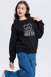 Polerón niña print básico negro con estampado frontal