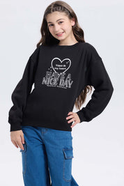 Polerón niña print básico negro con estampado frontal