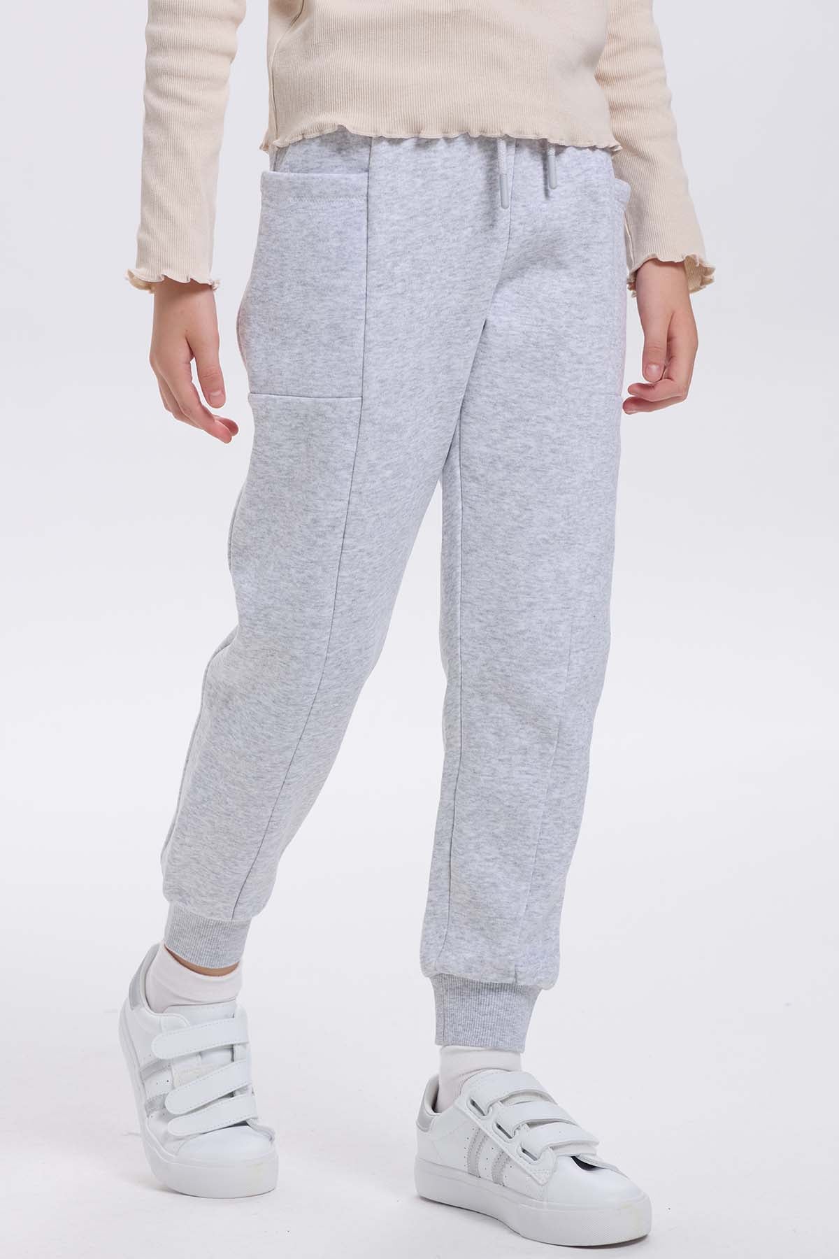 Pantalón Buzo niña Bipack Rosado liso con bolsillos
