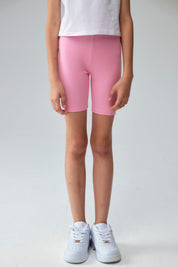 Calza niña biker turquesa con estampado de corazones pequeños en varios colores