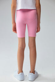 Calza niña biker turquesa con estampado de corazones pequeños en varios colores