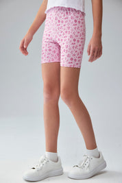 Calza niña biker rosado con estampado de íconos en fondo claro