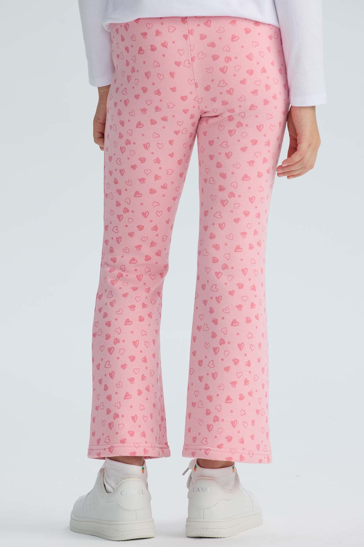 Calza rosada con estampado de corazones para niña