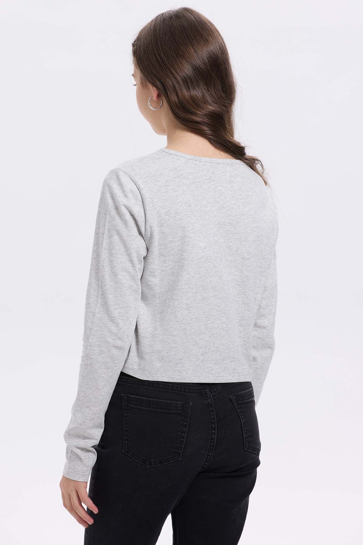 Polera niña print posicional gris melange