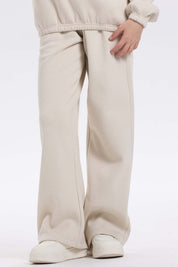 Pantalón buzo niña wide leg brillo beige