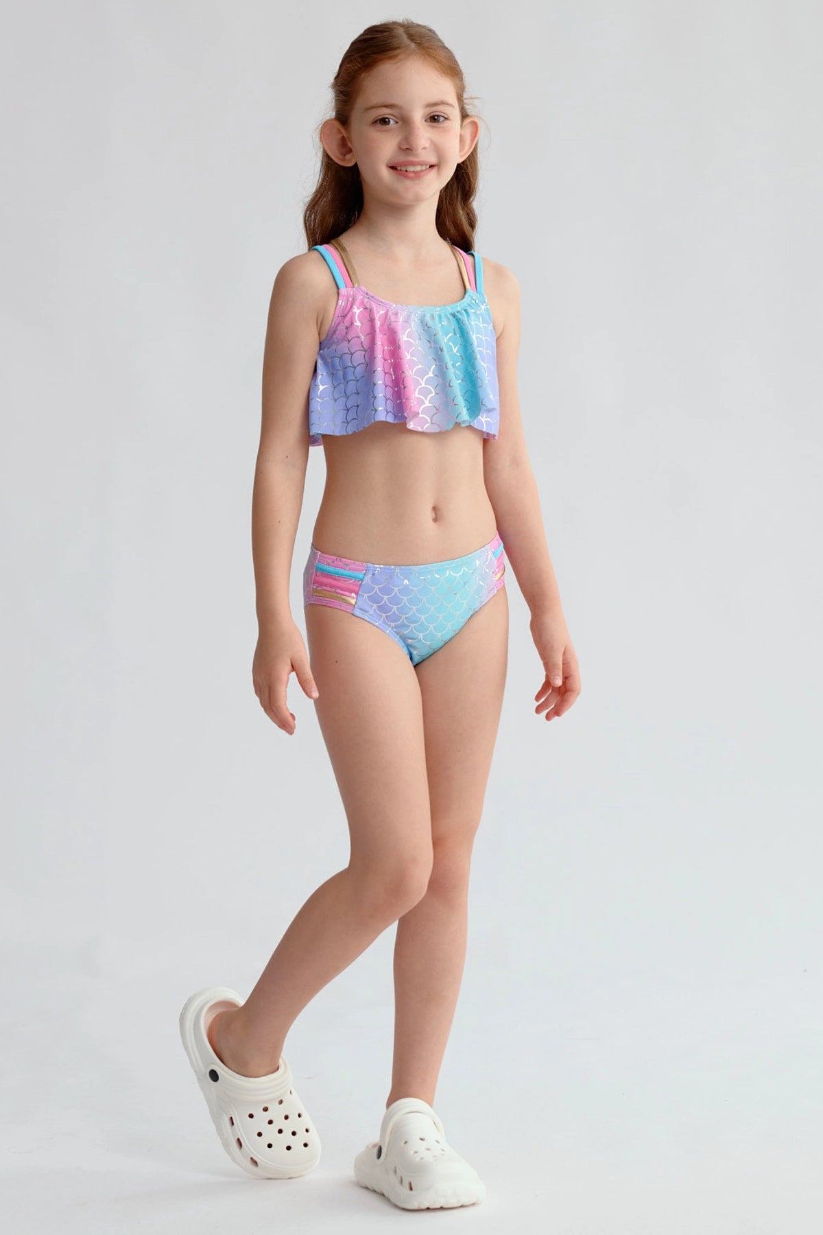 Traje de baño niña azul con estampado de escamas y detalles en rosa y morado