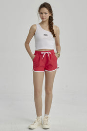Short de baño niña liso fucsia con ribete blanco y lazo ajustable en la cintura