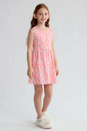 Vestido niña coral con estampado de piñas blancas sin mangas