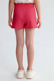 Short niña color fucsia con cintura elasticada y textura visible