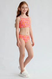 Traje de baño niña fucsia con estampado de hojas y espalda cruzada