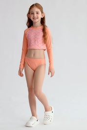 Traje de baño coral con polera de manga larga y diseño floral