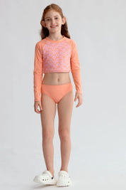 Traje de baño coral con polera de manga larga y diseño floral