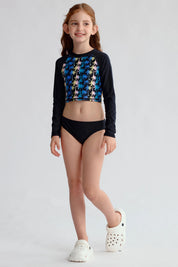 Traje de baño niña negro con polera estampada de palmeras coloridas manga larga
