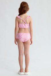 Traje de baño bikini niña rosado con estampado dorado de estrellas y volantes en los tirantes