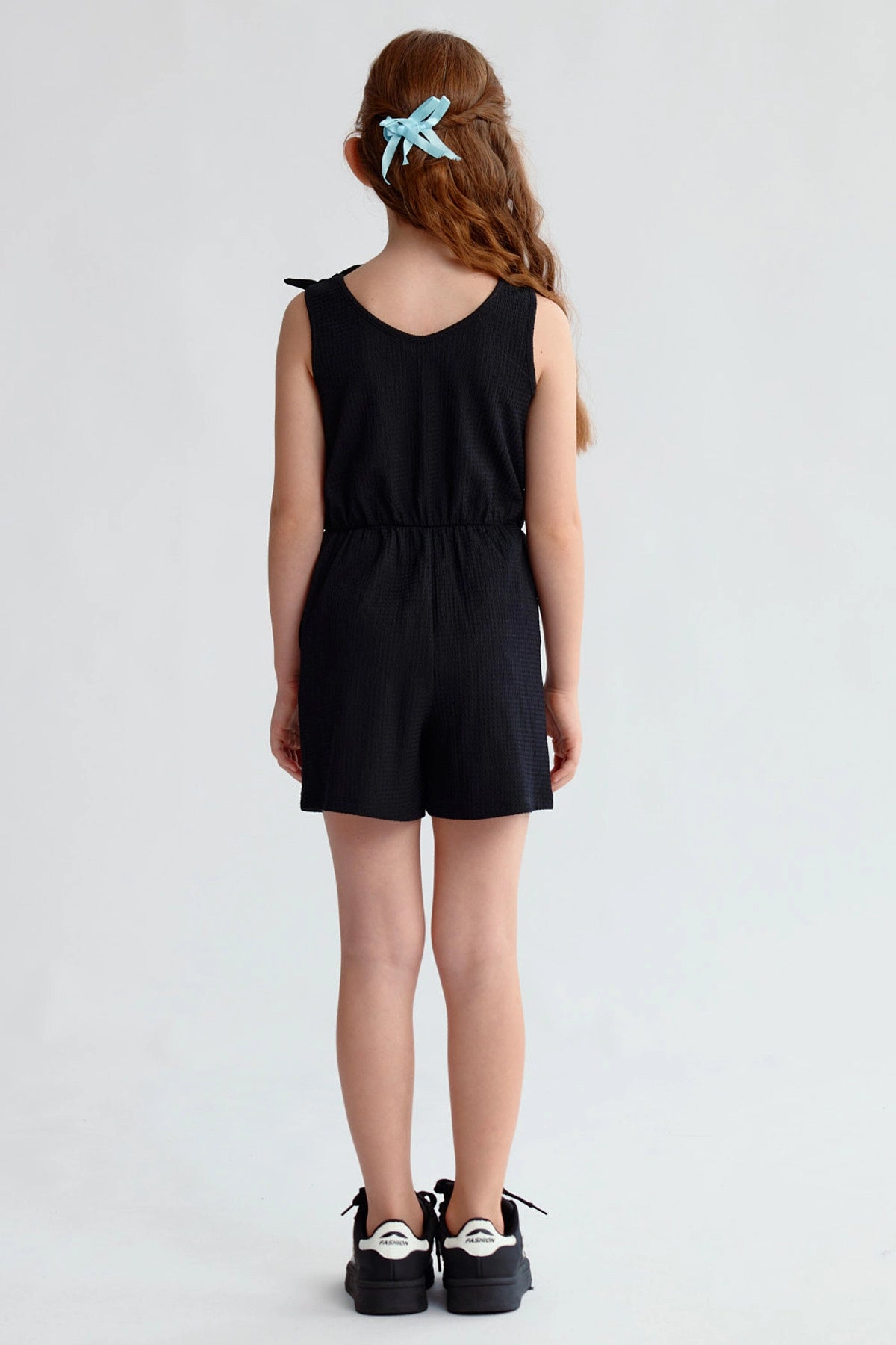 Enterito negro niña con nudos en los hombros y diseño sin mangas