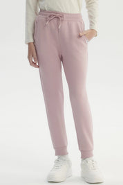 Pantalón jogger rosado para niña con cintura elástica y cordón liso sin estampa ajuste cómodo y bolsillos laterales