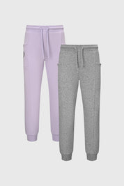 Pantalones buzo niña lila y gris con bolsillos laterales sin estampa diseño cómodo y relajado ideales para jugar