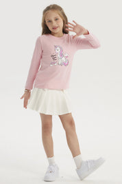 Polera rosa para niña con estampado de unicornio multicolor al frente y texto Dream Come True en estilo infantil