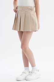 Falda beige para niña con slip integrado diseño plisado cinturón ajustable detalle en el lado sin estampa lisa