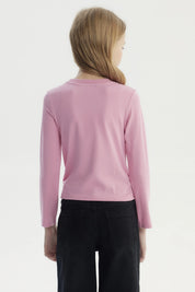 Polera slim rosada para niña con texto Beautiful Bowknot y lazo de terciopelo en el pecho estilo casual y juvenil