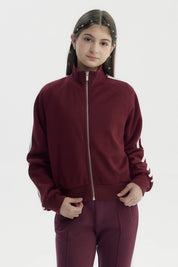 Chaqueta burdeo para niña con cierre y cuello alto diseño liso sin estampa ideal para días frescos