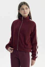Chaqueta burdeo para niña con cierre y cuello alto diseño liso sin estampa ideal para días frescos
