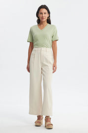 Pantalón recto beige claro para mujer con cintura elástica y detalles de botones en el frente diseño liso elegante