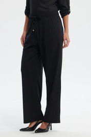 Pantalón buzo mujer negro calce recto con cintura elástica y cordón ajustable prenda lisa