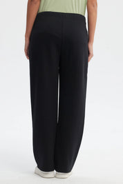 Pantalón buzo mujer negro calce recto con pretina elástica y lazo decorativo liso cómodo y casual