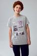 Polera gris melange para niño con diseño básico y estampado visible al frente