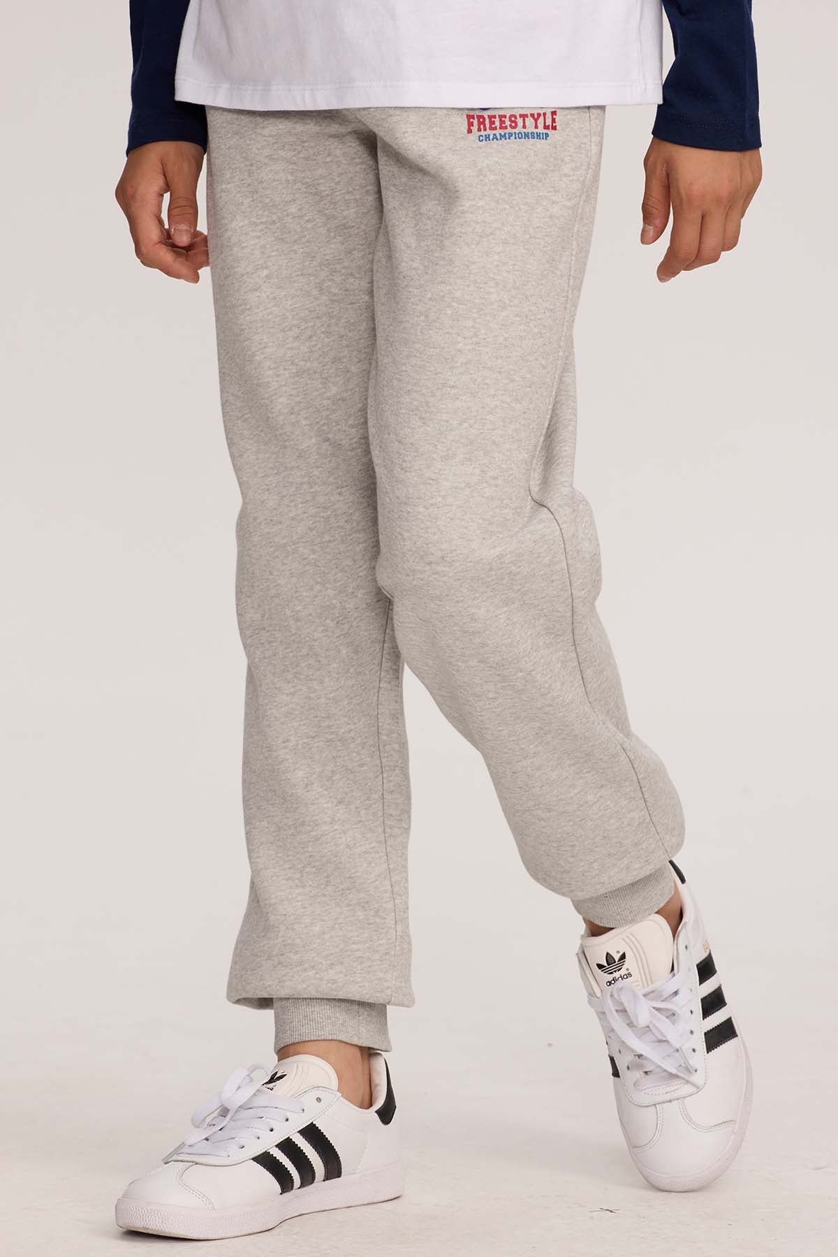 Pantalón buzo niño jogger gris melange