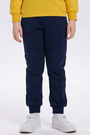 Pantalón buzo niño azul oscuro con rayas lateral
