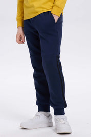 Pantalón buzo niño azul oscuro con rayas lateral