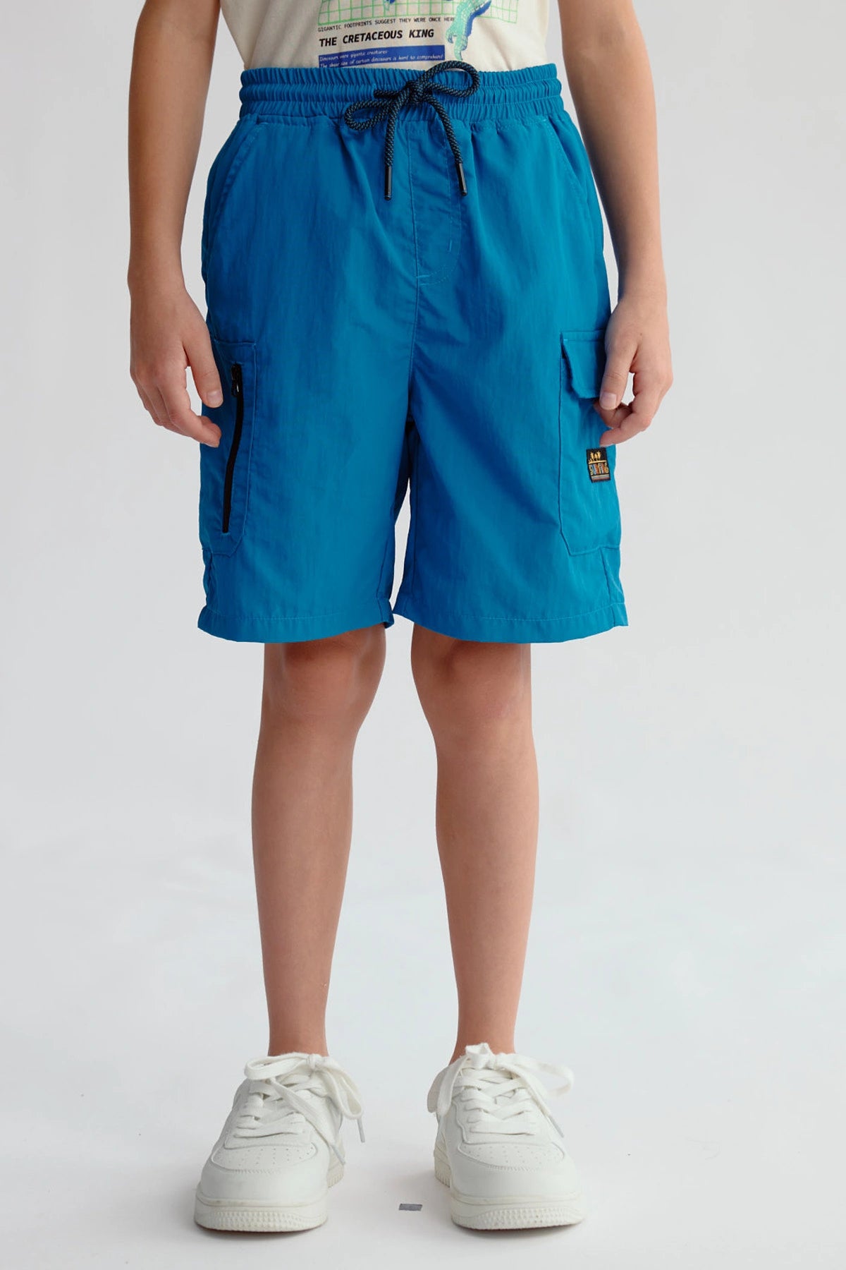 Bermuda Niño Cargo Azul Petroleo con bolsillos y ajuste elástico