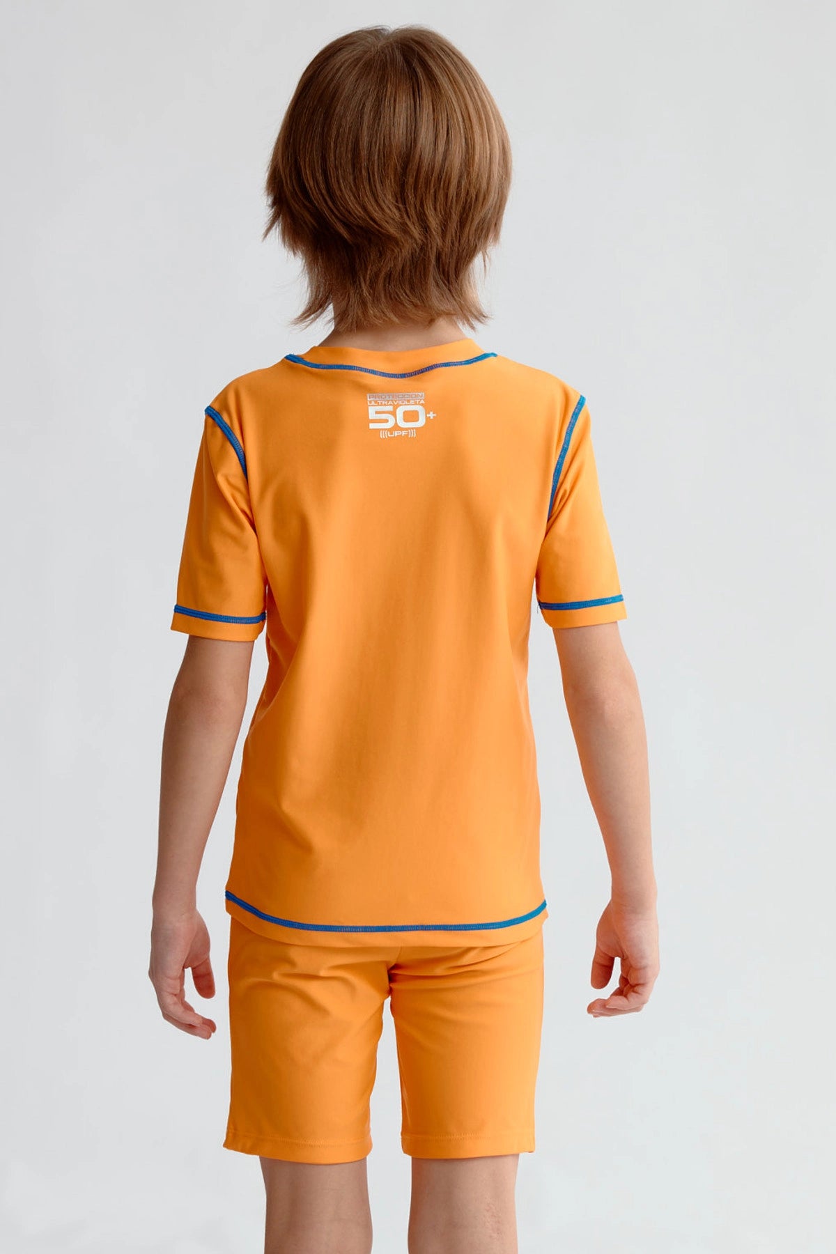 Traje de baño niño naranjo con estampado California Beach y detalles en azul