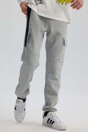 Pantalón Buzo Niño Cortes Bolsillo Gris Melange