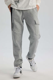 Pantalón Buzo Niño Cortes Bolsillo Gris Melange