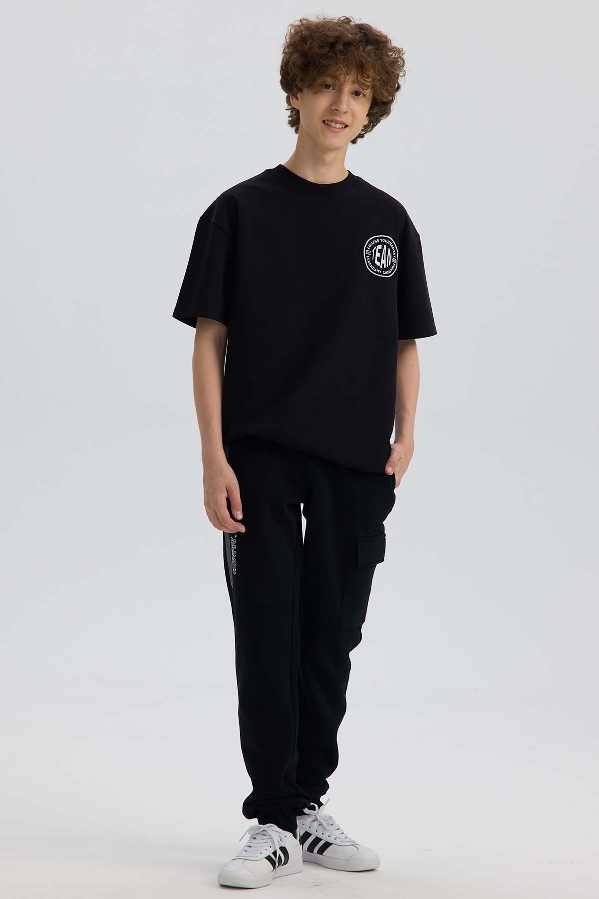 Pantalón Buzo Niño Cortes Bolsillo Negro