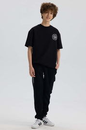 Pantalón Buzo Niño Cortes Bolsillo Negro