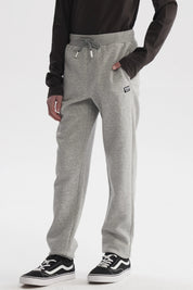 Pantalón buzo gris melange para niño con ajuste de cordón en la cintura y diseño liso ideal para actividades diarias