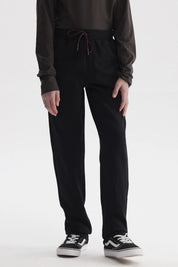 Pantalón buzo gris melange para niño con ajuste de cordón en la cintura y diseño liso ideal para actividades diarias