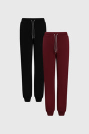 Bipack de pantalones buzo para niño en negro y burdeos con cintura elástica y cordones visibles diseño liso