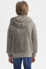 Polar gris para niño con textura peluda cierre frontal y capucha ideal para días fríos diseño liso y moderno