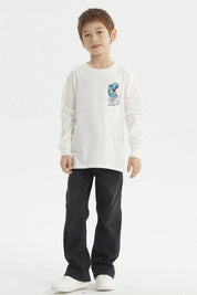 Polera crudo de niño con estampa de dinosaurio azul y texto Just Ride en el pecho estilo casual y gráfico