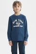 Polera niño azul petróleo con puños y estampa central de tigre y texto New York Superior Team estilo deportivo