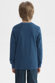 Polera niño azul petróleo con puños y estampa central de tigre y texto New York Superior Team estilo deportivo