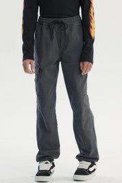 Pantalón pitillo marengo para niño con bolsillos laterales y cintura ajustable diseño liso cómodo para uso diario