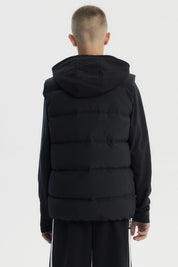Parka sin mangas negra para niño con capucha y cierre frontal diseño liso ideal para el frío urbano